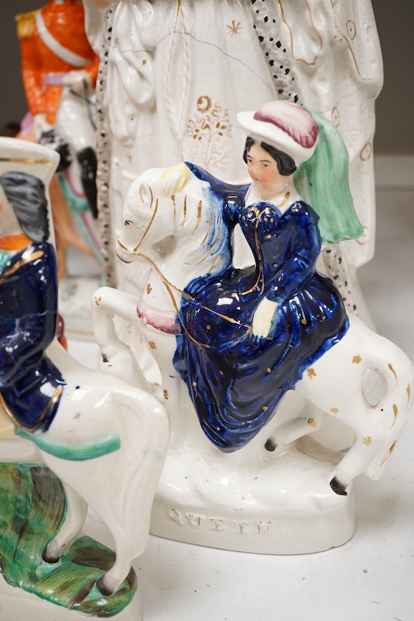 A collection of seven Staffordshire figures, including Queen Victoria - 45cm high, a cricketer, a boy reading, Tom King etc